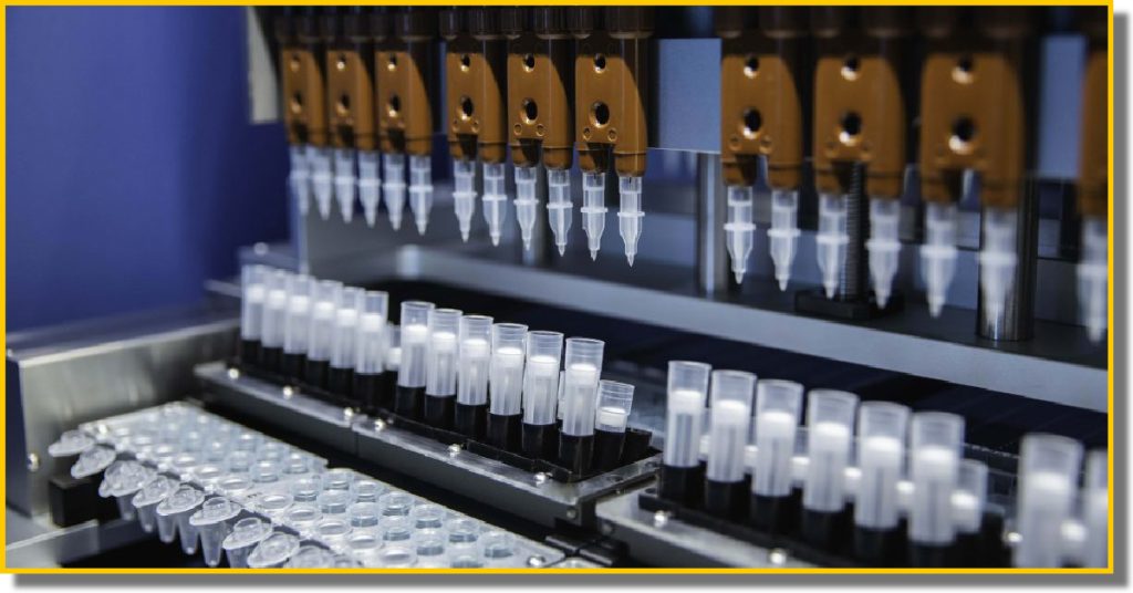 A complex machine featuring numerous tubes and needles, used for medical and laboratory purposes.