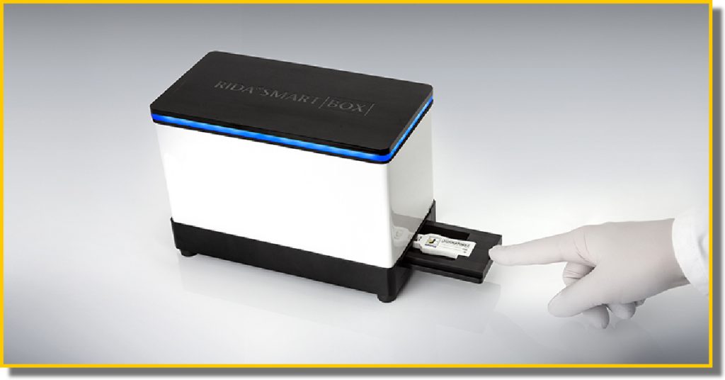 A person uses a small black and white piece of technology in their hands, showcasing its compact design usability features.