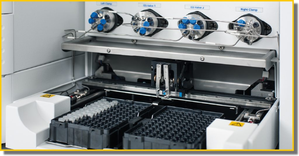 A laboratory machine displaying two distinct types of test tubes for scientific analysis and experimentation.