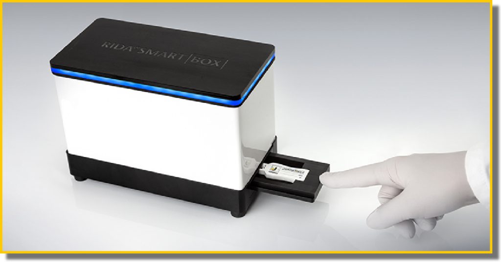 A person holds a small electronic device in their hand, showcasing its compact size and modern design