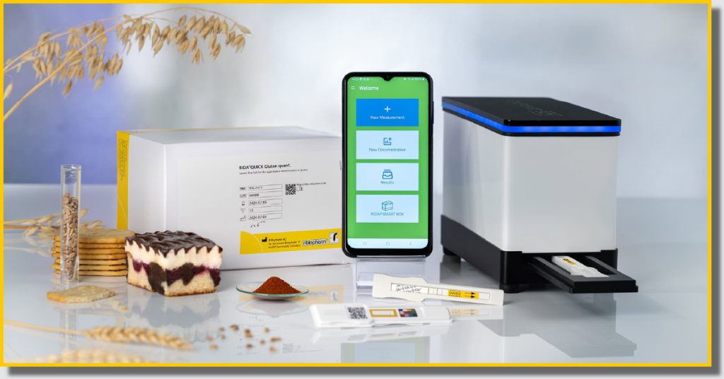 a phone displaying an app next to a piece of technology with food surrounding it